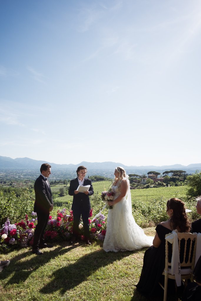 Tommaso officiating a symbolic wedding ceremony overlooking the Tuscan hills