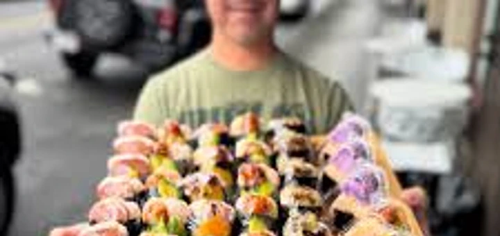 Poke Market catering tray of poke musubi and sushi rolls