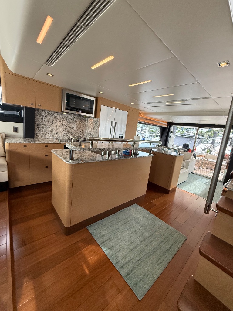 Luxury yacht galley and lounge detailed and staged for FLIBS showings in Fort Lauderdale
