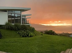 Modern white bungalows with sunset views over Lake Arenal