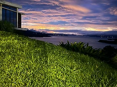 Arenal Lake Bungalows at twilight overlooking Lake Arenal