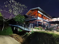 Night exterior with illuminated ramp and deck