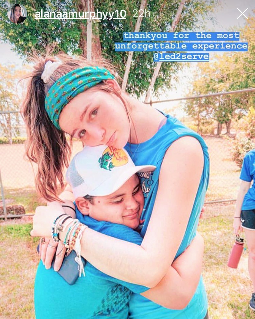 Two volunteers embracing — thankful for an unforgettable Led2Serve experience