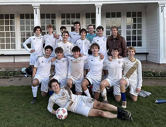 NCAFC players posing on the pitch after a match