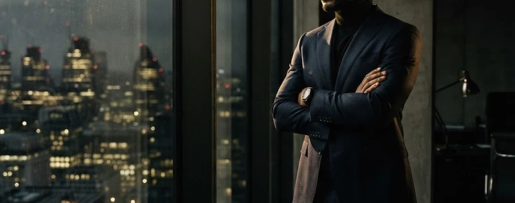 A visionary CEO looking out over the city, contemplating a flattened growth trajectory