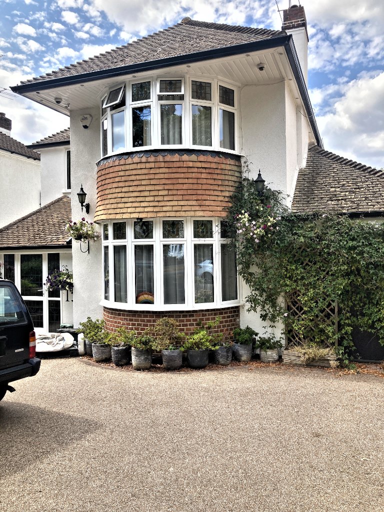 Rendered bay & brickwork