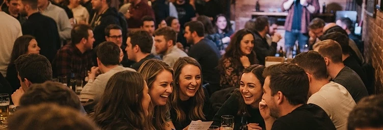 A packed bar on trivia night with teams competing at every table