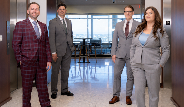 Majors Law Group attorneys standing in the firm's office hallway