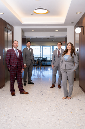 Majors Law Group attorneys standing in the firm's office hallway