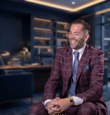 Dominic Majors, founding attorney of Majors Law Group, laughing in his office