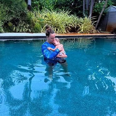Coach Shireen with a baby during an ISR lesson