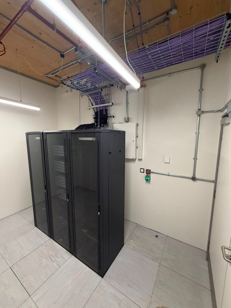 Server room — racks and overhead cable tray routing