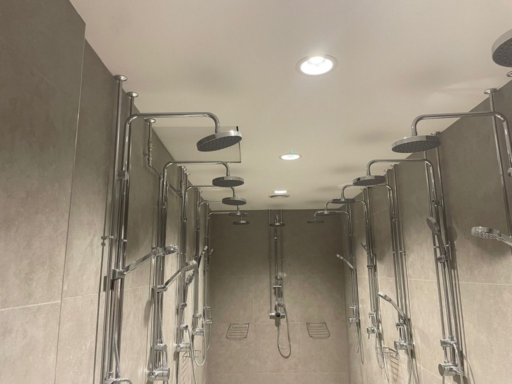 Shower facility with chrome rainfall shower heads