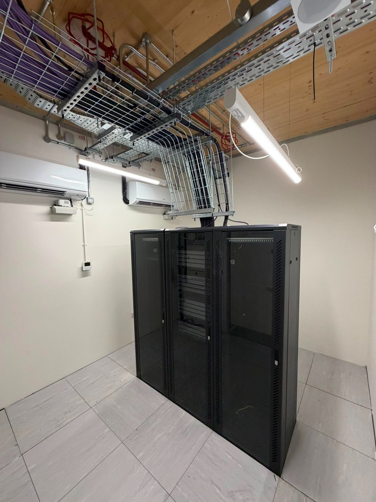 MDF room — server racks with structured cabling and AC units