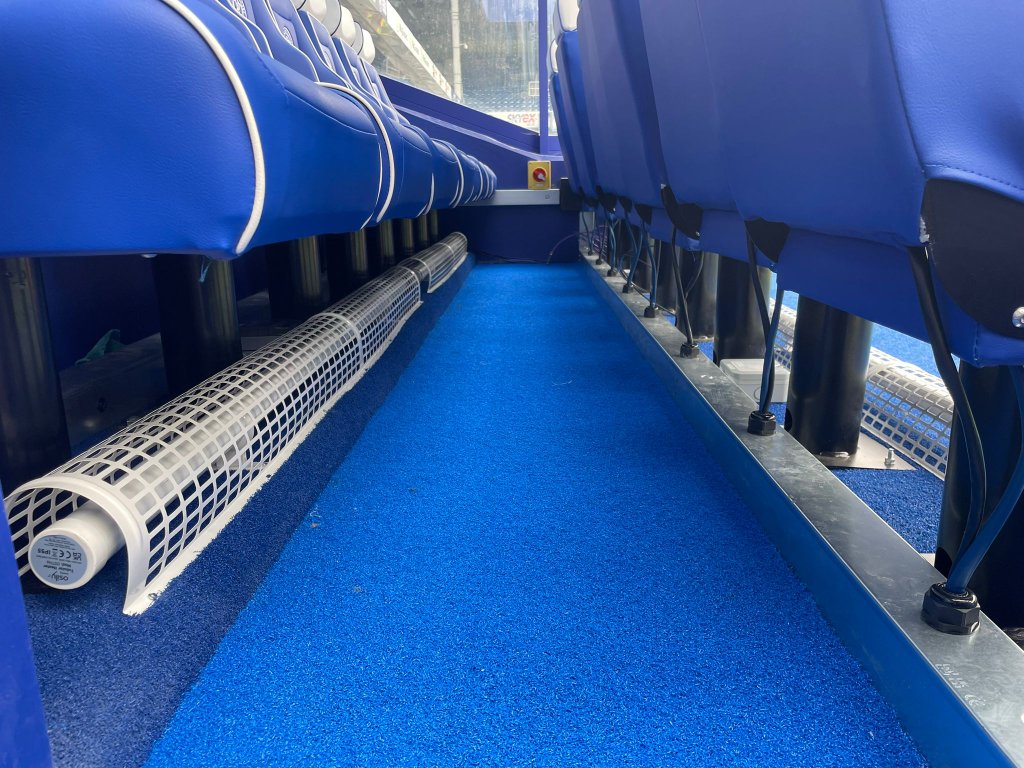 Dugout seating with tubular heating and cable management