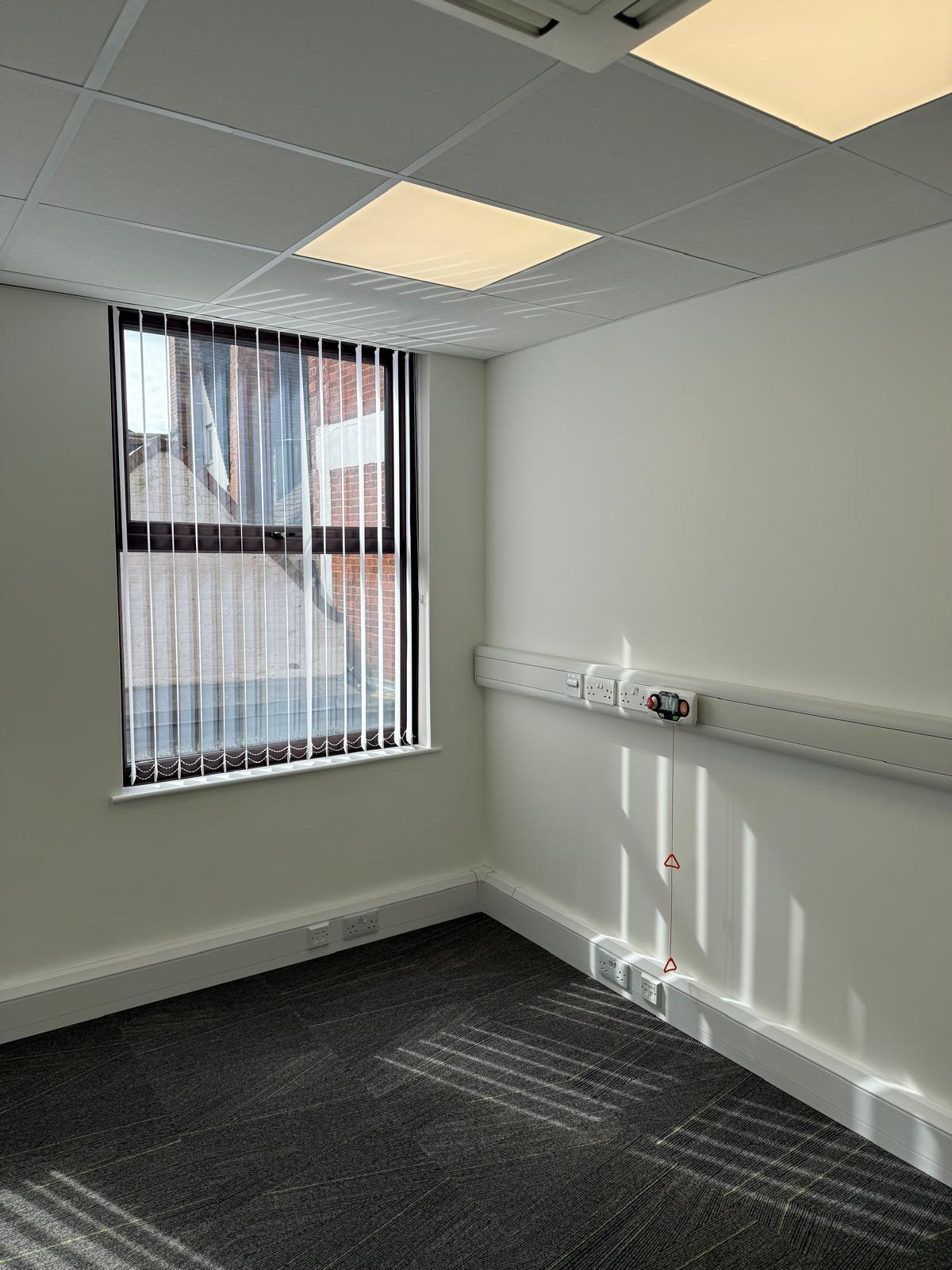 Office space with vertical blinds and emergency pull-cord trunking