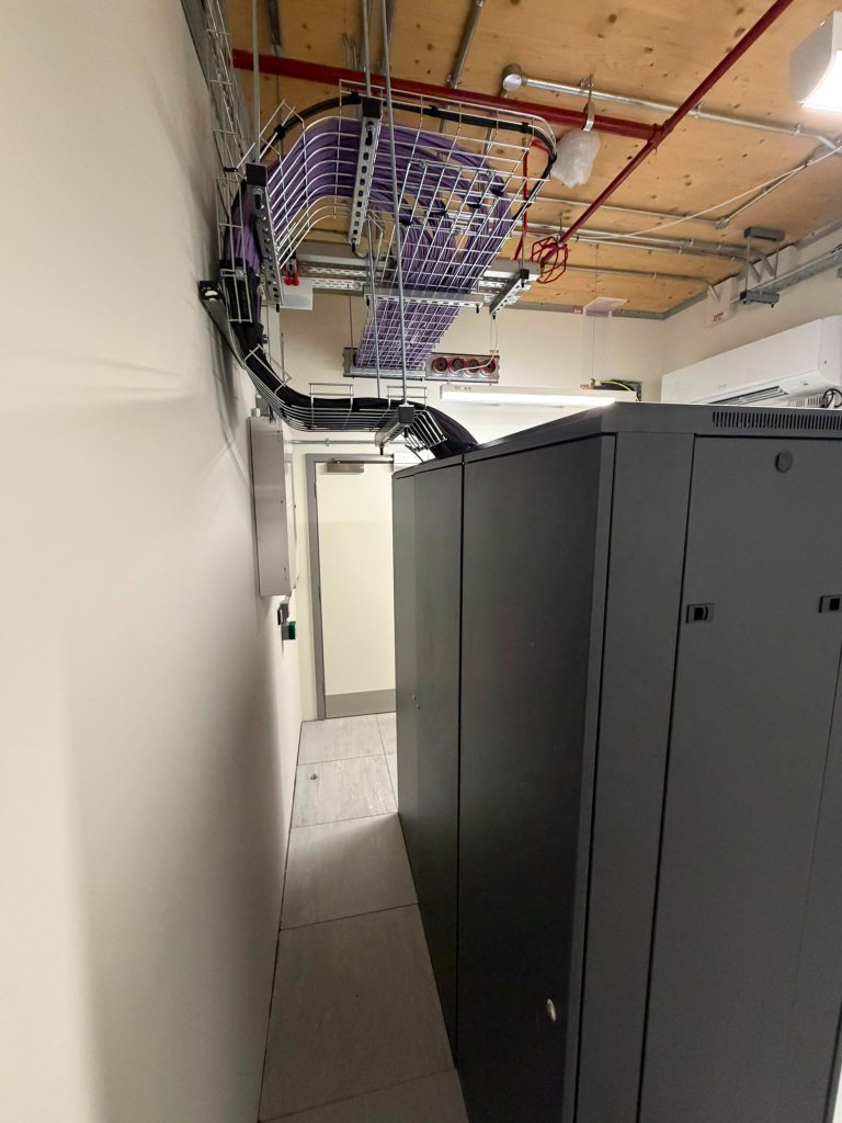 Rear of IDF racks showing cable management and containment