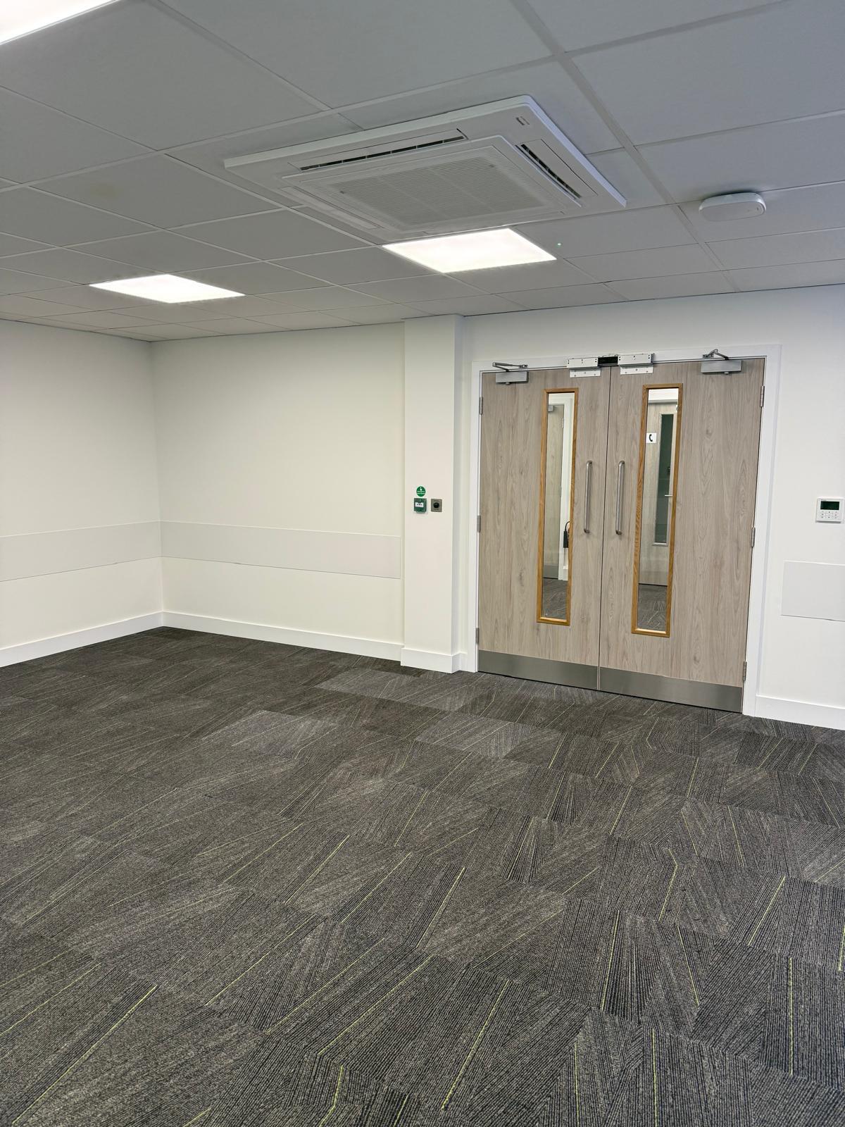Corridor with double doors and ceiling air conditioning cassette
