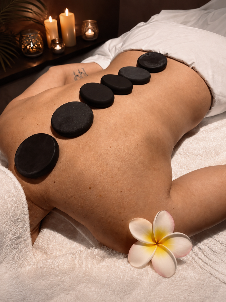 Hot stones arranged on a guest during a spa treatment