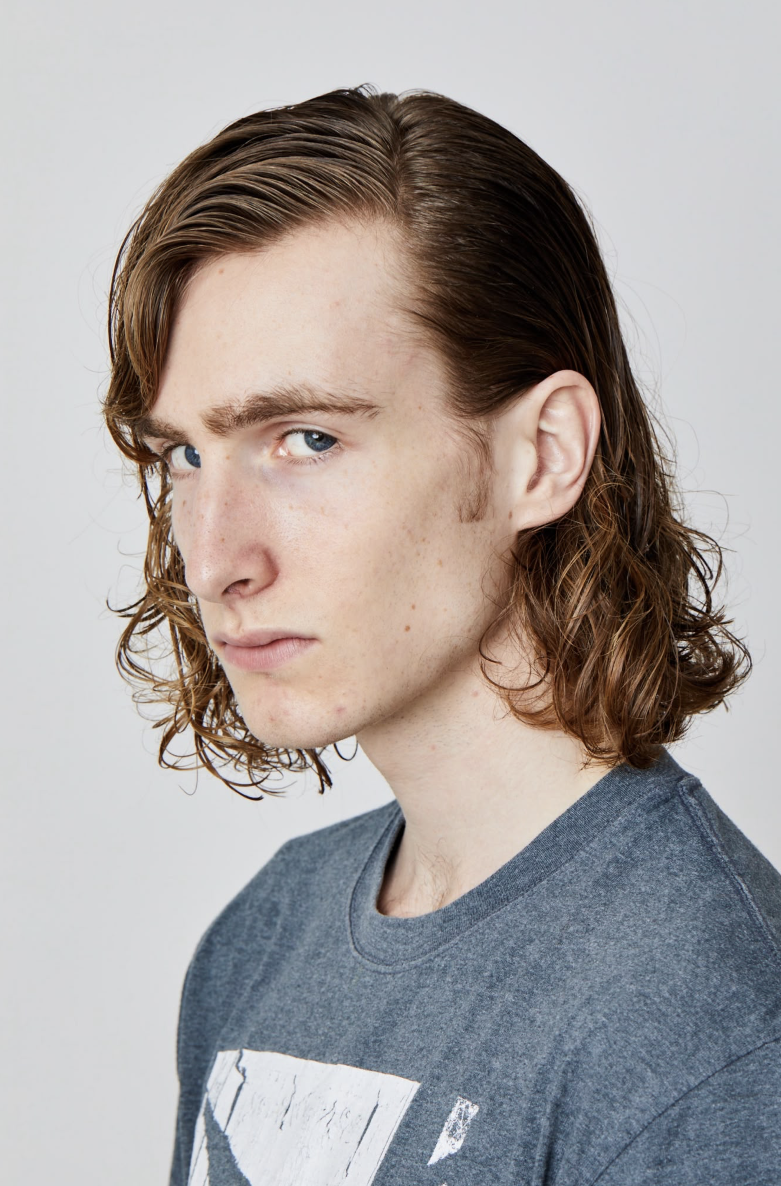 Light-brown wavy slicked style