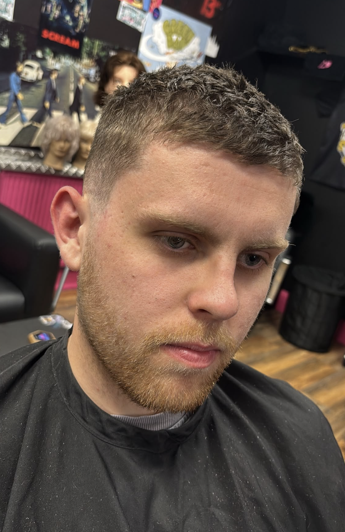 Mid-skin fade textured crop with light beard