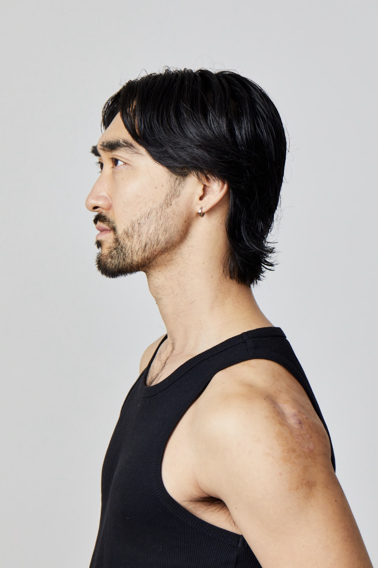 Slicked-back medium length with beard