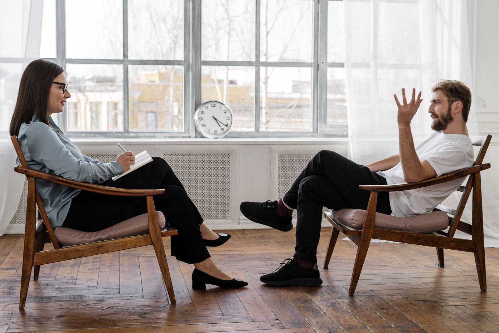 Counselor and client talking in a warm, professional office