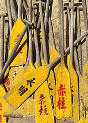 Nostalgia Card by ViewThroughJen'sLens - A close-up view of multiple yellow paddles, each displaying unique lettering and wear, reflecting their use in outdoor activities
