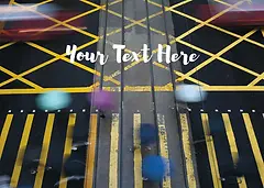 Customisable Nostalgia Card by ViewThroughJen'sLens - An overhead view of a crosswalk with yellow diagonal lines, showing blurred figures of pedestrians in motion and vehicles passing by