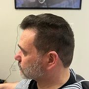 Taper fade with textured brushed-forward top — men's haircut in Flemington NJ by Matthew Paul