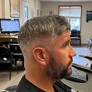 Skin fade with textured top and trimmed beard — Flemington NJ barber