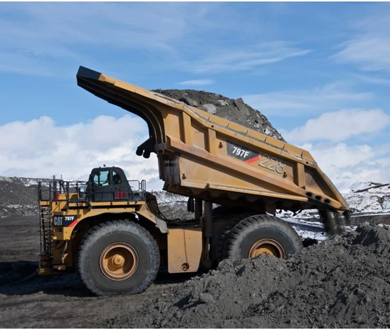 CAT 797F mining haul truck dumping load