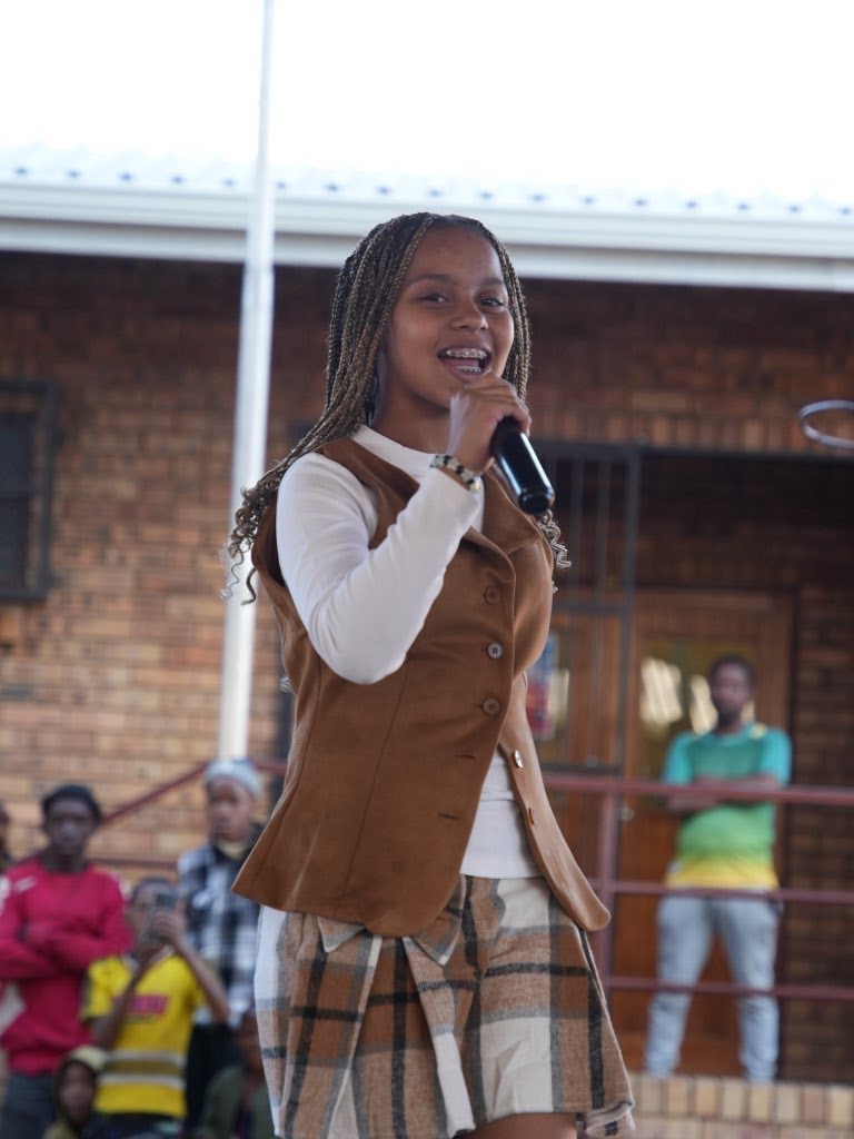 Aubrey performing outdoors