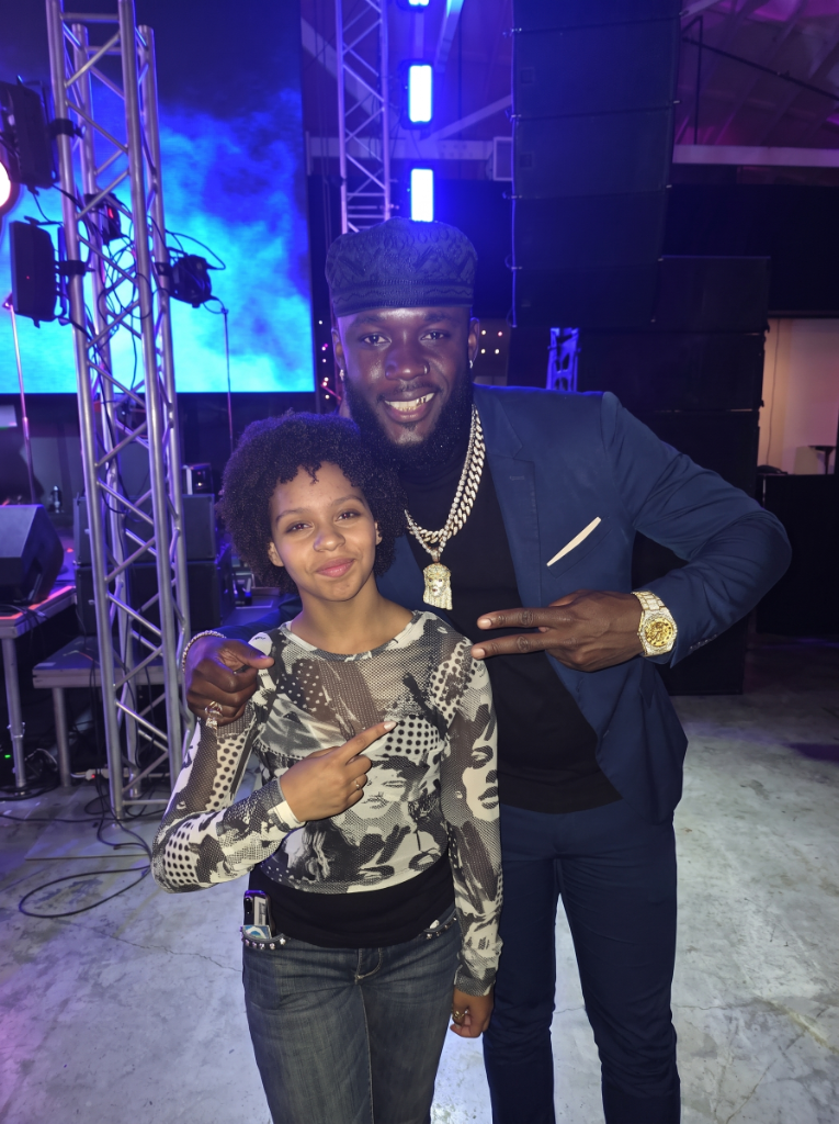 Aubrey with an artist backstage