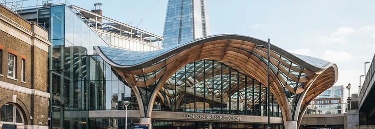 London Bridge Station with modern glass and steel architecture near the Shard in bright natural daylight