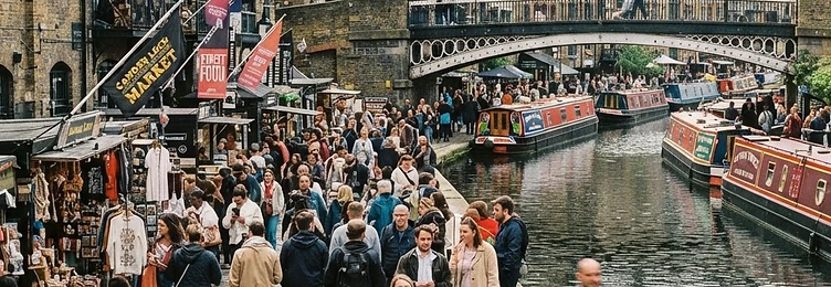 Camden with Victorian architecture and a bustling market atmosphere by the canal in bright natural daylight
