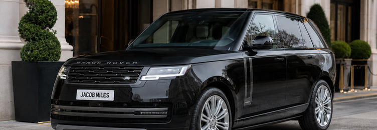 Jacob Miles black Range Rover chauffeur vehicle parked outside a luxury London hotel