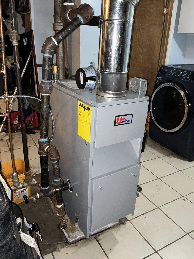 Heating system with furnace and flue pipe installed by NGC Sheetmetal in Greater Boston