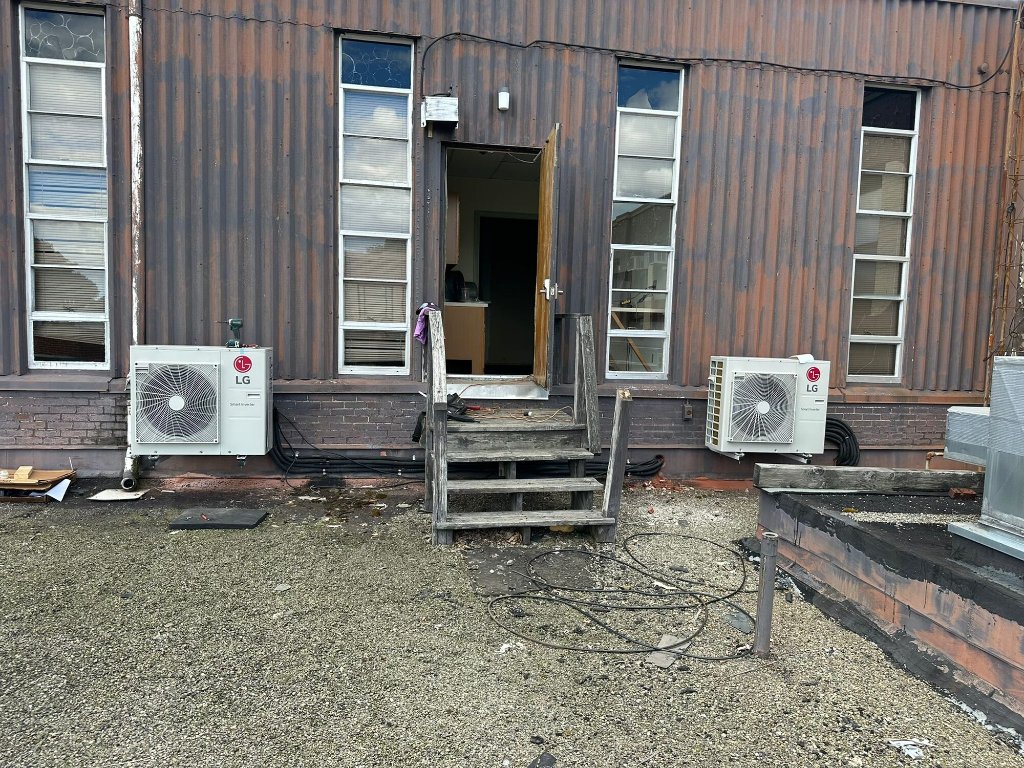 Exterior wall-mounted ductless condensers installed by NGC Sheetmetal in Greater Boston