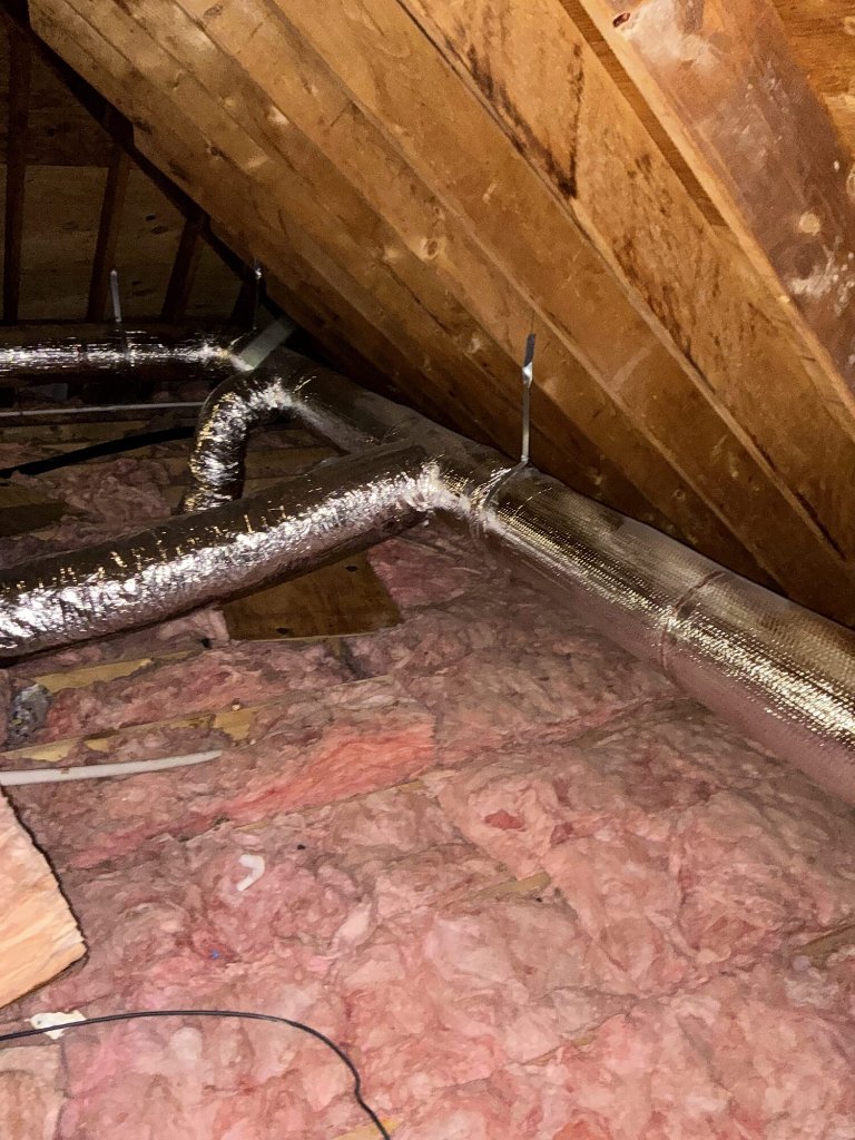 Custom insulated sheet metal ductwork installed by NGC Sheetmetal in a Greater Boston attic