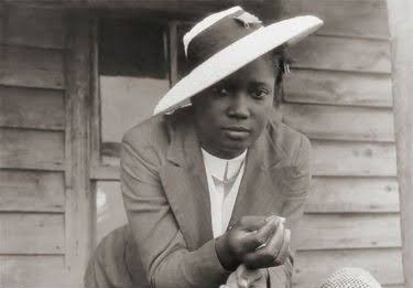 archival portrait of a Black woman in a wide-brimmed hat