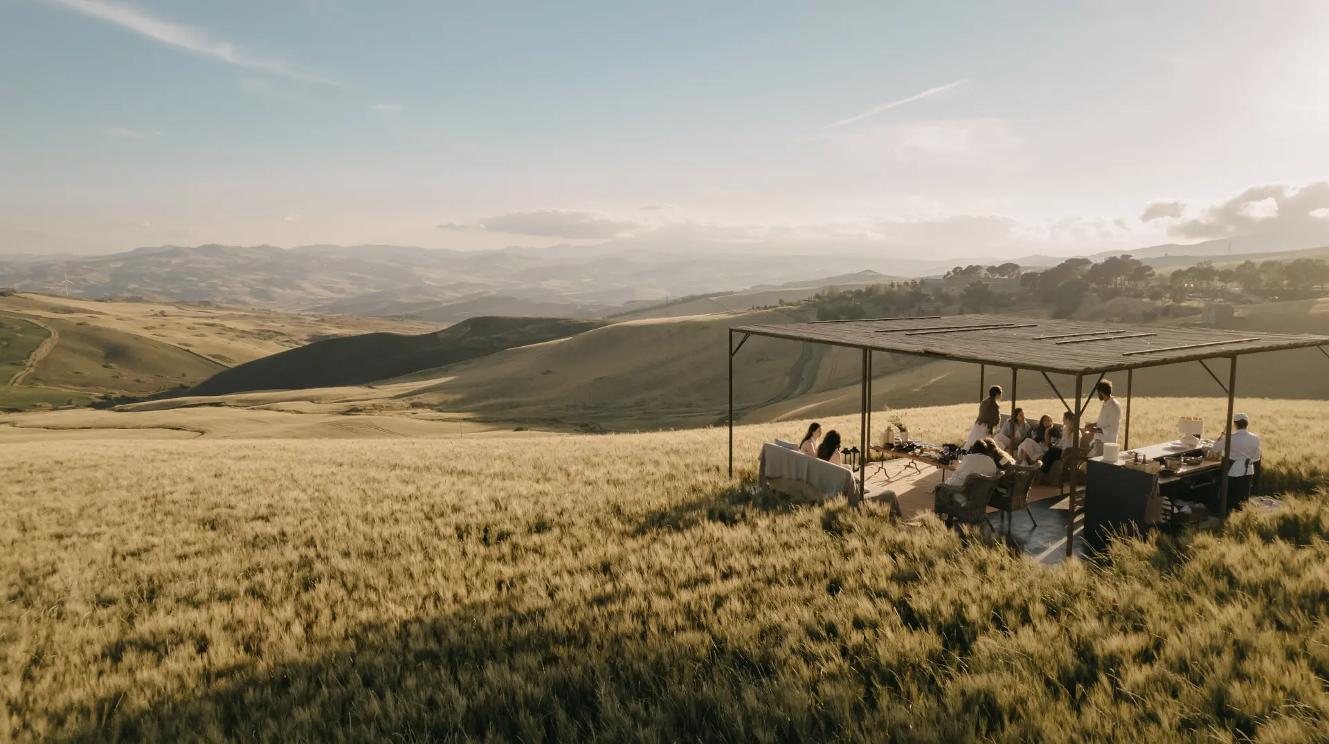 An aperitivo gathered among the golden Madonie fields at dusk