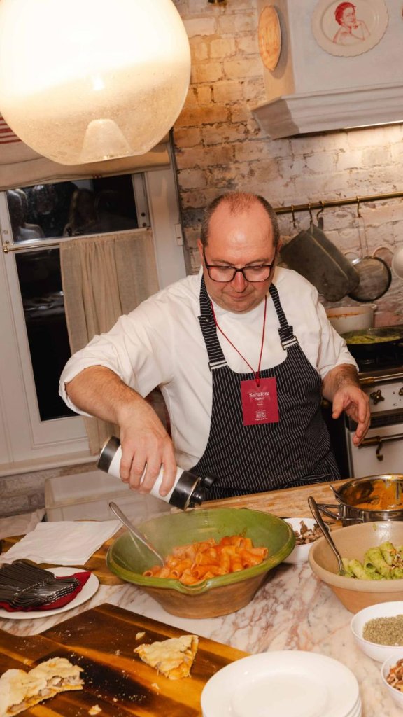 Chef finishing a dish with olive oil