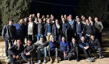Lev Campus students gathered at night