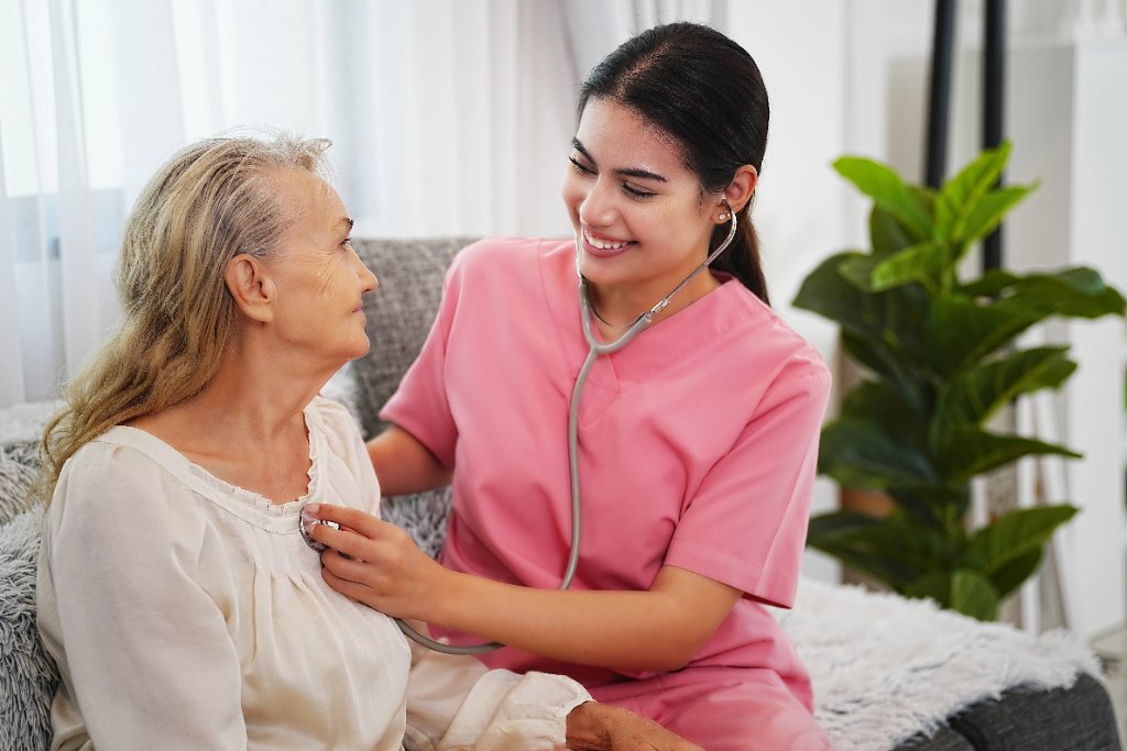 Caregiver and senior sharing a warm moment in a bright British Columbia home