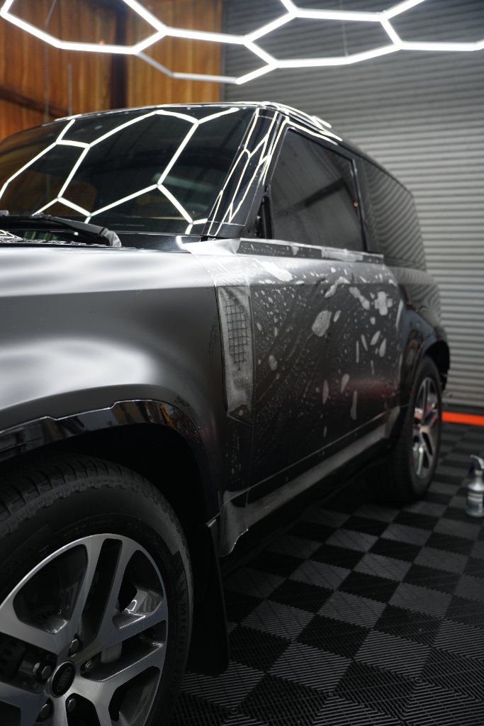 Matte black Defender mid PPF application