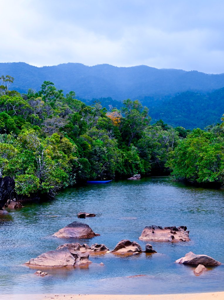 River winding through Masoala rainforest with misty mountains