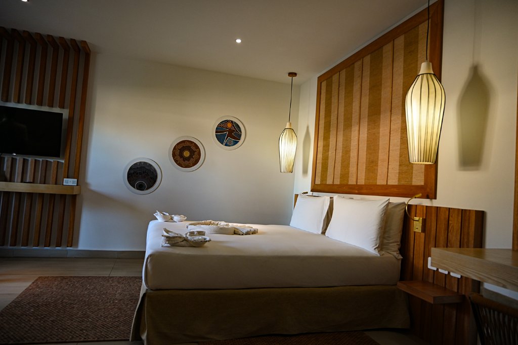 Boutique hotel room in Madagascar with warm wooden decor