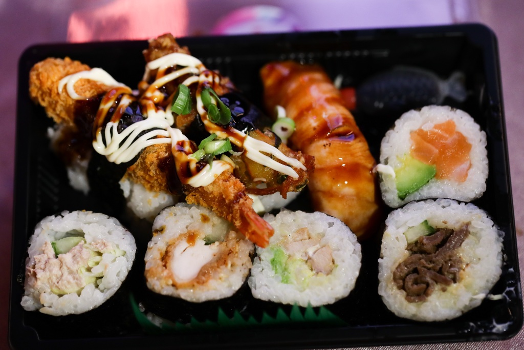 Custom sushi bento box with assorted rolls and nigiri