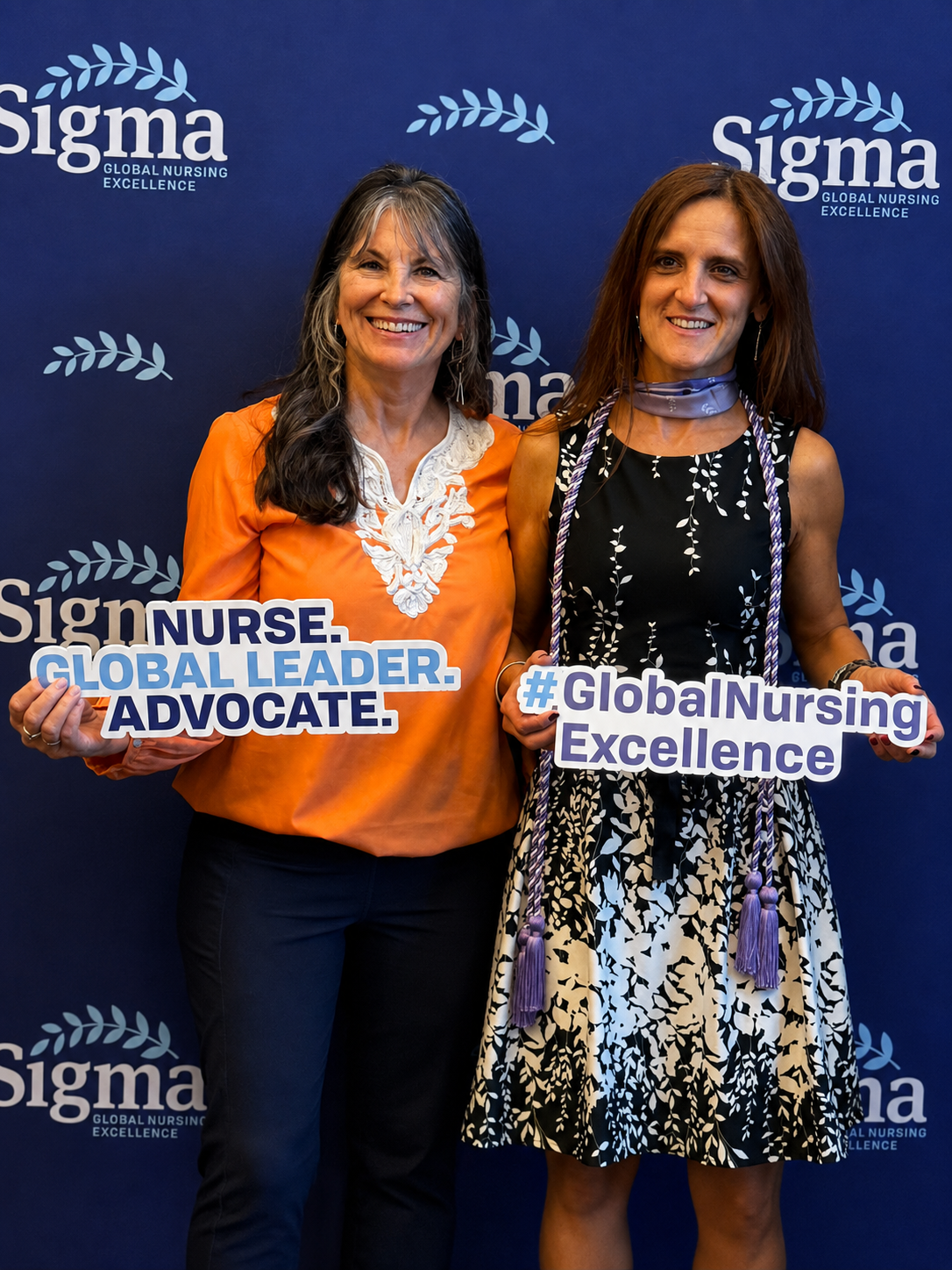 Dr. Judi Allyn Godsey and Dr. Hildegart Gonzalez Luis at a Sigma Global Nursing Excellence event.